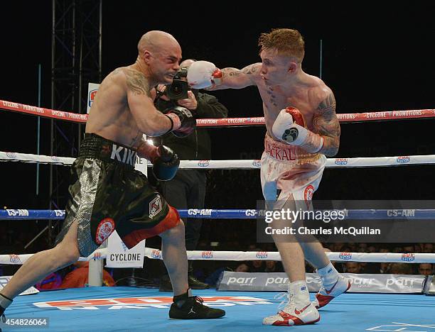 Carl Frampton of Northern Ireland lands a punch during the IBF super-bantamweight world title bout against world champion Kiko Martinez of Spain, at...