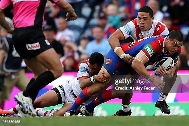 Timana Tahu of the Knights scores a try during the round 26 NRL match between the Newcastle Knights and the St George Illawarra Dragons at Hunter...