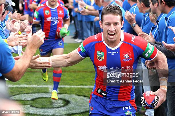 Kurt Gidley of the Knights leads his team onto the ground during the round 26 NRL match between the Newcastle Knights and the St George Illawarra...