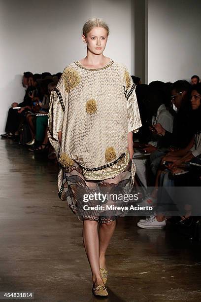 Model walks the runway wearing Ammar Belal's collections at Parsons MFA runway show during MADE Fashion Week Spring 2015 at Milk Studios on September...