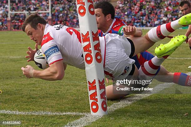 Brett Morris of the Dragons about to put the ball down but the try was disallowed during the round 26 NRL match between the Newcastle Knights and the...