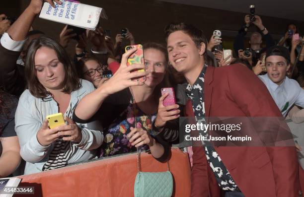 Actor Ansel Elgort poses for a selfie with a fan as he attends the Gala Screening of Paramount Pictures' "MEN, WOMEN,& CHILDREN" during the 2014...