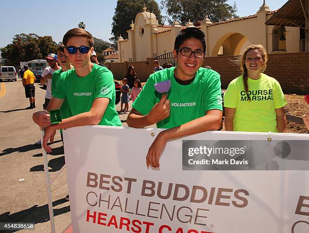 Best Buddies volunteers cheer riders on at the finish line of the Best Buddies Challenge Hearst Castle at Hearst Ranch on September 6, 2014 in San...