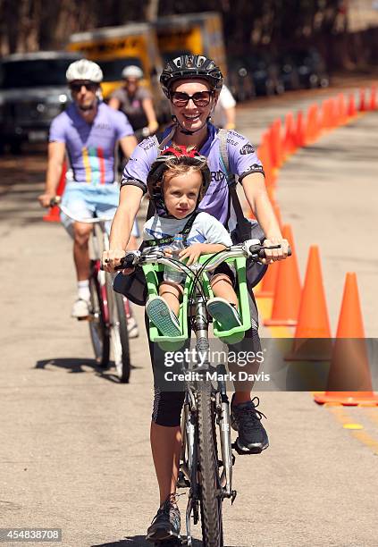 Team Maria rider crosses the finish line of the Best Buddies Challenge Hearst Castle at Hearst Ranch on September 6, 2014 in San Simeon, California.