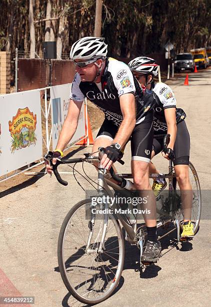 Team Gallo riders cross the finish line of the Best Buddies Challenge Hearst Castle at Hearst Ranch on September 6, 2014 in San Simeon, California.