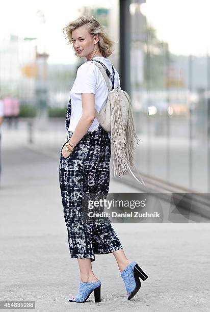 Blogger Zanita Whittington is seen outside the Tibi show wearing a Tibi Jumpsuit, Tibi shoes and a Barbara Bonner backpack on September 6, 2014 in...