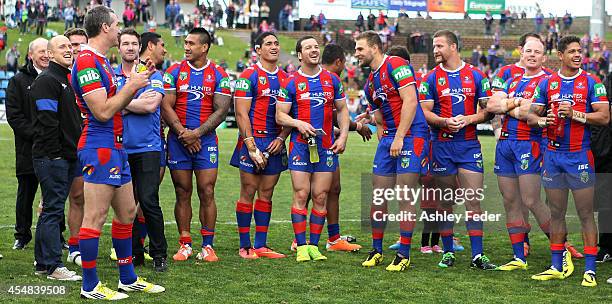 Newcastle Knights teammates celebrate the win after the round 26 NRL match between the Newcastle Knights and the St George Illawarra Dragons at...