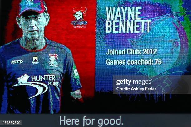 Photo of Wayne Bennett appears on the large screen after coaching his last game for the Knights after the round 26 NRL match between the Newcastle...