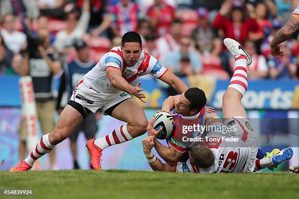 Jarrod Mullen of the Knights scores a try during the round 26 NRL match between the Newcastle Knights and the St George Illawarra Dragons at Hunter...