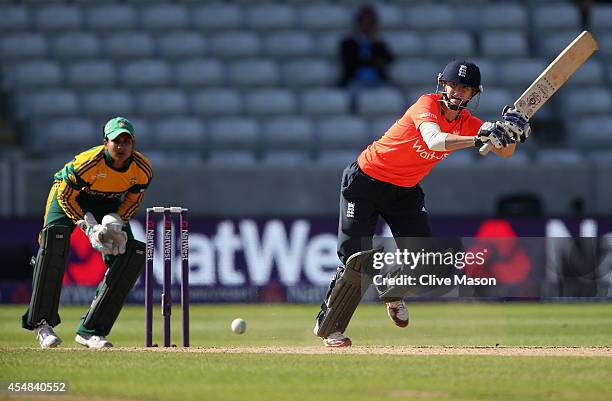 Lydia Greenway of England in action batting as Trisha Chetty of South Africa looks on during the NatWest Women's International T20 match between...