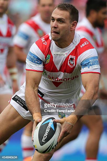 Jason Nightingale of the Dragons looks to pass the ball during the round 26 NRL match between the Newcastle Knights and the St George Illawarra...