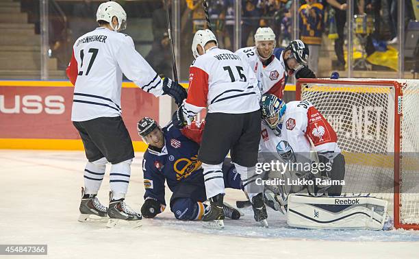 Druval Westcott of Hamburg Freezers interference Aaron Gagnon of Rauman Lukko during the Champions Hockey League group stage game between Lukko Rauma...