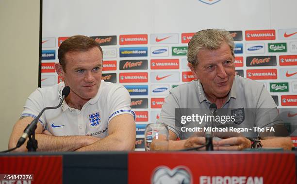 Wayne Rooney and England manager Roy Hodgson speak to the media ahead of the England training session at St. Jakob-Park on September 7, 2014 in...