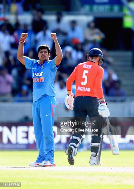 Karn Sharma of India celebrates dismissing Joe Root of England during the NatWest International T20 2014 match between England and India at Edgbaston...