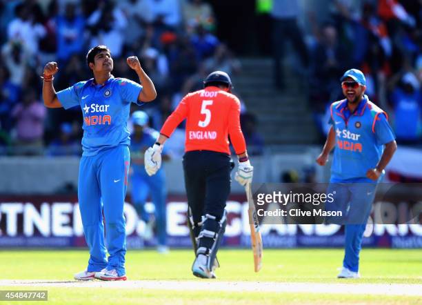 Karn Sharma of India celebrates dismissing Joe Root of England during the NatWest International T20 2014 match between England and India at Edgbaston...