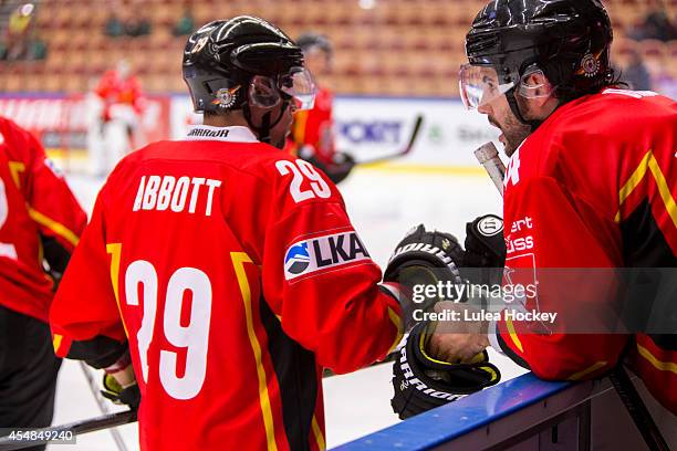 Chris Abbott of Lulea Hockey congratulated after scoring by teammate Stephen Dixon during the Champions Hockey League group stage game between Lulea...