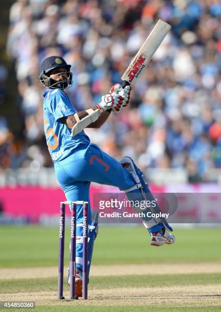 Shikhar Dhawan of India hits out for six runs during the NatWest International T20 between England and India at Edgbaston on September 7, 2014 in...