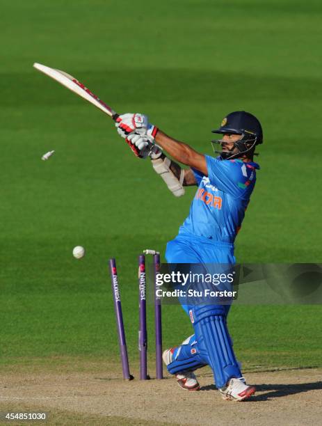 India batsman Shikhar Dhawan is bowled by Chris Woakes during the NatWest T20 International between England and India at Edgbaston on September 7,...