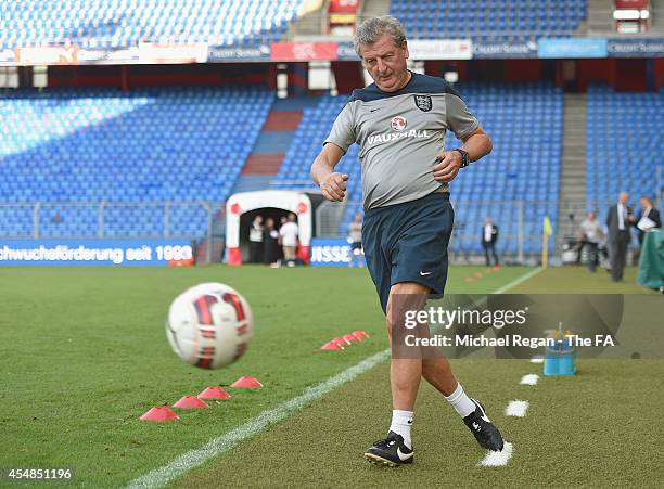 England manager Roy Hodgson kicks the ball during the England training session at St. Jakob-Park on September 7, 2014 in Basel, Basel-Stadt.