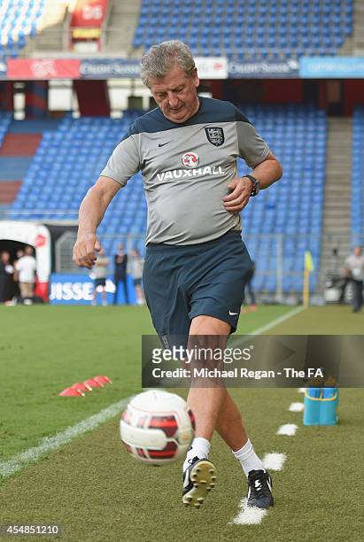 England manager Roy Hodgson kicks the ball during the England training session at St. Jakob-Park on September 7, 2014 in Basel, Basel-Stadt.