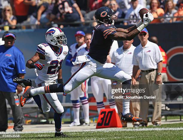Alshon Jeffery of the Chicago Bears catches a pass in front of Leodis McKelvin of the Buffalo Bills during the first quarter of their game at Soldier...