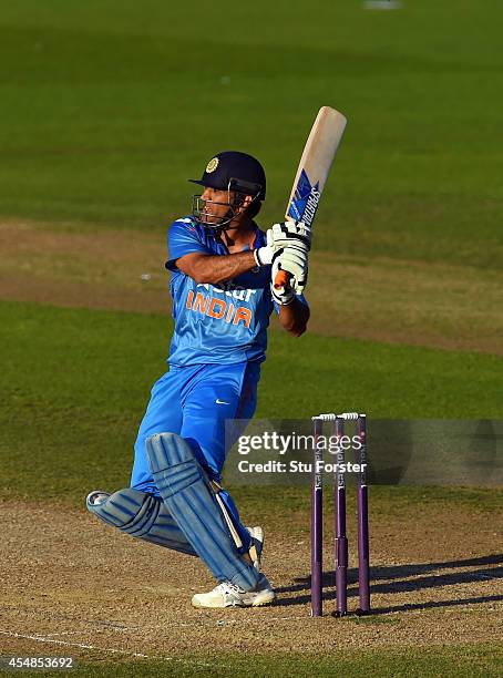 India batsman MS Dhoni hits out during the NatWest T20 International between England and India at Edgbaston on September 7, 2014 in Birmingham,...