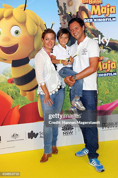 Julia Dahmen with husband Carlo Fiorito and son Emilio attend the German premiere of the film 'Die Biene Maja - Der Kinofilm' at Mathaeser Filmpalast...