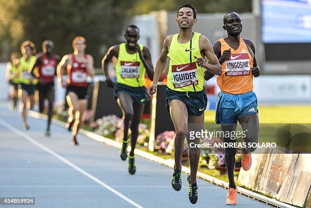 Morocco's Abdelaati Iguider competes and wins ahead of second-placed Kenya's Thomas Pkemei Longosiwa during the men's 3000m event at the 44th IAAF...