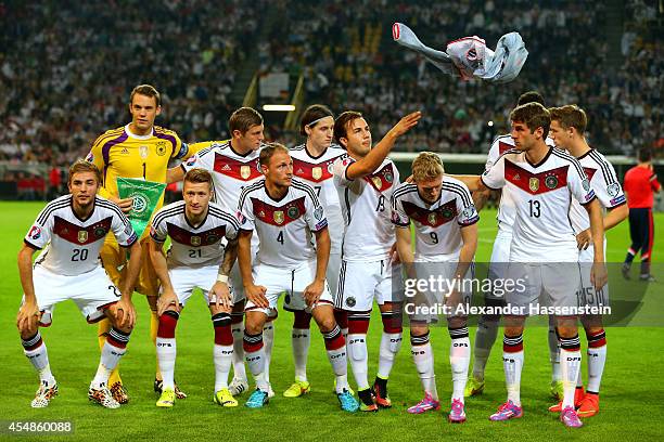 Mario Goetze of Germany throws his jacket away as he prepares to pose with the rest of the team for a group photo before the EURO 2016 Group D...