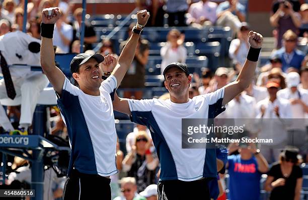Bob Bryan and Mike Bryan of United States celebrate after defeating Marcel Granollers and Marc Lopez of Spain in their men's doubles final match on...