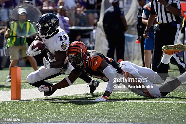 Running back Justin Forsett of the Baltimore Ravens scores a touchdown during an NFL football game against the Cincinnati Bengals at M&T Bank Stadium...