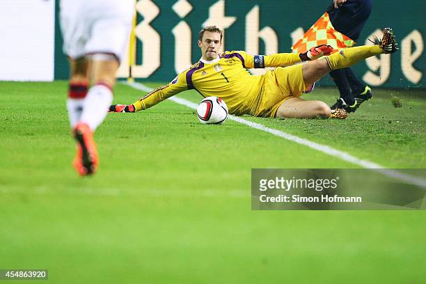 Goalkeeper Manuel Neuer of Germany savs a ball during the EURO 2016 Qualifier match between Germany and Scotland at Signal Iduna Park on September 7,...