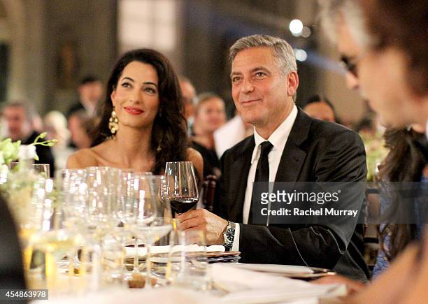 George Clooney and Amal Alamuddin attend the Celebrity Fight Night gala celebrating Celebrity Fight Night In Italy benefitting The Andrea Bocelli...