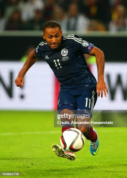 Ikechi Anya of Scotland scores their first goal during the EURO 2016 Group D qualifying match between Germany and Scotland at Signal Iduna Park on...