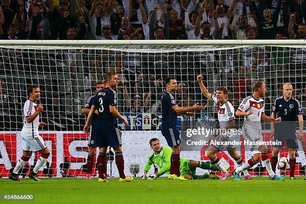 Thomas Mueller of Germany celebrates scoring their second goal during the EURO 2016 Group D qualifying match between Germany and Scotland at Signal...