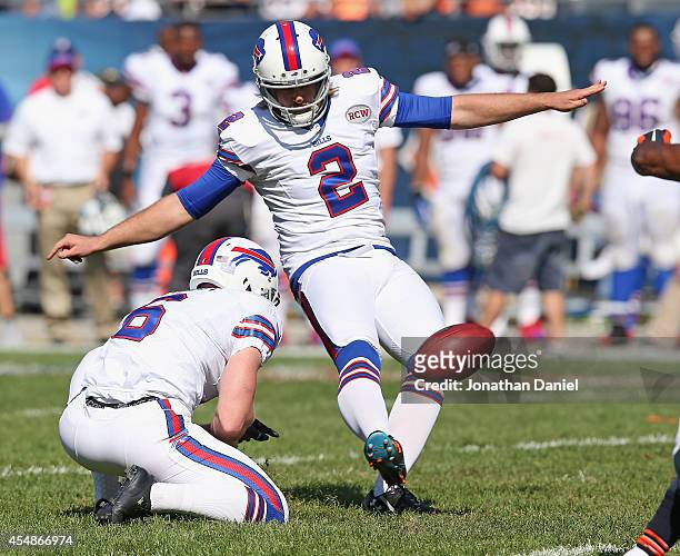 Dan Carpenter of the Buffalo Bills kicks the game winning field goal in overtime to defeat the Chicago Bears 23-20 at Soldier Field on September 7,...