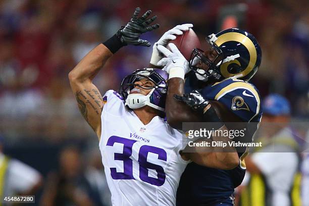 Jared Cook of the St. Louis Rams makes a catch against Robert Blanton of the Minnesota Vikings at the Edward Jones Dome on September 7, 2014 in St....