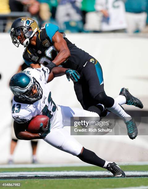 Darren Sproles of the Philadelphia Eagles is tackled in the end zone by Alan Ball of the Jacksonville Jaguars after a 49 yard run for a touchdown...
