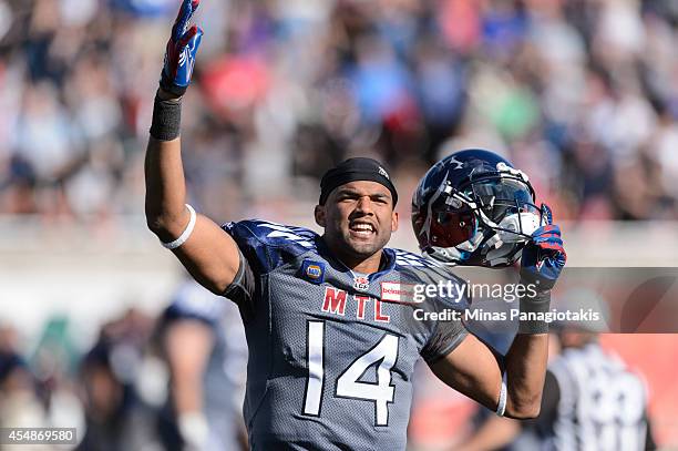 Brandon London of the Montreal Alouettes celebrates a victory over the Hamilton Tiger-Cats during the CFL game at Percival Molson Stadium on...