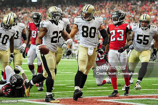 Mark Ingram celebrates a touchdown with Jimmy Graham of the New Orleans Saints in the second half against the Atlanta Falcons at the Georgia Dome on...