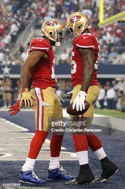 Michael Crabtree of the San Francisco 49ers and Vernon Davis of the San Francisco 49ers celebrate Davis' touchdown against the Dallas Cowboys in the...