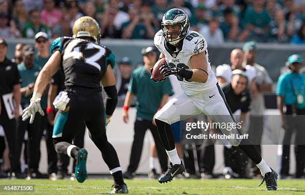 Tight end Zach Ertz of the Philadelphia Eagles catches a pass in the third quarter with saftey Chris Prosinski of the Jacksonville Jaguars defending...