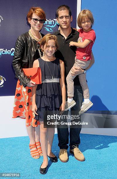Actress Molly Ringwald and husband Panio Gianopoulos arrive at the Los Angeles premiere of "Dolphin Tale 2" at Regency Village Theatre on September...