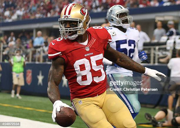 Vernon Davis of the San Francisco 49ers reacts after scoring a touchdown as Justin Durant of the Dallas Cowboys is near in the first half at AT&T...
