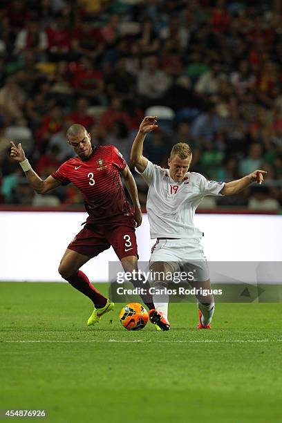 Portugal defender Pepe tries to stop Albania forward Bekim Balaj during the EURO 2016 qualification match between Portugal and Albania at Estadio de...