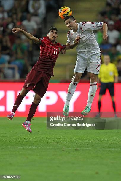 Albania forward Odise Roshi battles Portugal forward Ricardo Horta during the EURO 2016 qualification match between Portugal and Albania at Estadio...