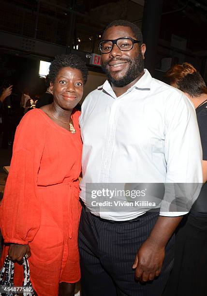 Director Steve McQueen and a guest backstage at the Tracy Reese fashion show during Mercedes-Benz Fashion Week Spring 2015 at Art Beam on September...