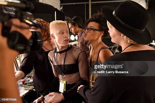 Model Shaun Ross and singer Elle Varner prepare backstage at the Etxeberria fashion show during Mercedes-Benz Fashion Week Spring 2015 at The...