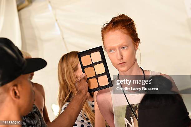 Model prepares backstage at the Etxeberria fashion show during Mercedes-Benz Fashion Week Spring 2015 at The Pavilion at Lincoln Center on September...