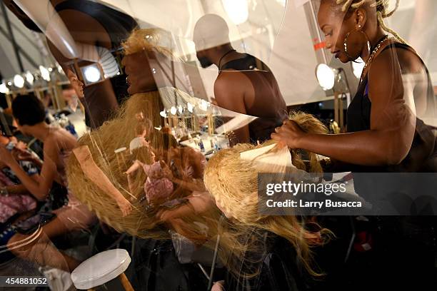 Model prepares backstage at the Etxeberria fashion show during Mercedes-Benz Fashion Week Spring 2015 at The Pavilion at Lincoln Center on September...